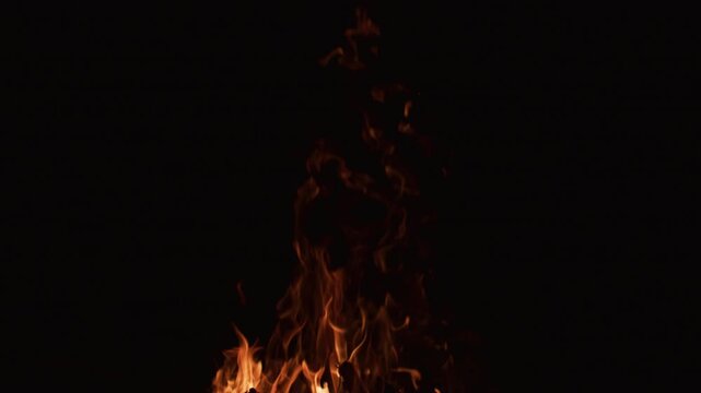 Fire slow motion flames on black background. Fire slow motion burning with natural glow. Fire slow motion blazing cinematic flow. Fire slow motion abstract flame texture.