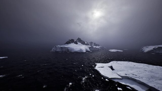 Bleak icy environment featuring dark water and muted sunlight. An arid icy expanse with shadowed liquid patches and subdued sunlight illuminating scene