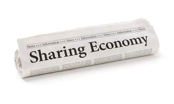 Rolled newspaper with the headline Sharing Economy