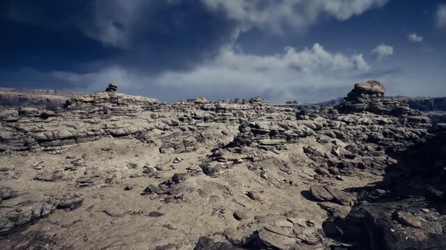 storm clearing over wind swept plateau, sunlight breaking through clouds, textured rock surfaces, dynamic lighting and high contrast scenery