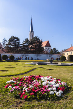 Maria Hietzing church and spring flower bed in the gardens of Schonbrunn Palace Vienna