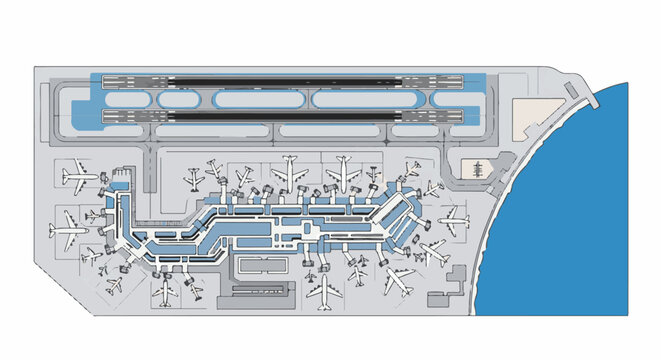 Aerial view of an airport with runways, terminal, and parked airplanes