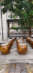Naklejka premium Collection of traditional Thai terracotta jars with beautiful local patterns