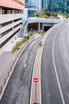 Sunlight on empty paris boulevard road with asphalt lane and sign creates urban perspective and wide open transport mood in quiet daytime