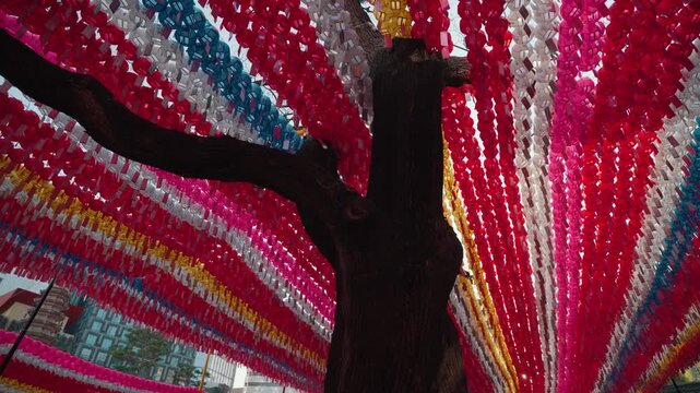 Colorful lantern canopy installation at Jogyesa Temple in Seoul, South Korea, featuring rows of vibrant hanging lanterns creating a festive atmosphere during temple celebrations and cultural events.