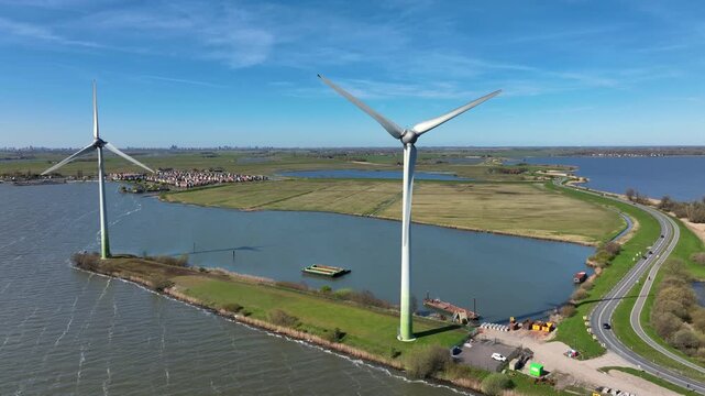 Wind turbines along a causeway in a coastal landscape in Europe
