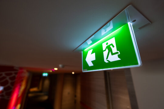 The illuminated panel supports navigation and rapid response, reinforcing compliance and structured emergency movement toward a safe exit in buildings.