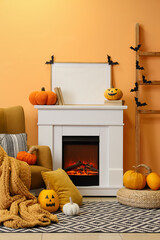 Naklejka premium Interior of living room decorated for Halloween with fireplace, armchair and pumpkins