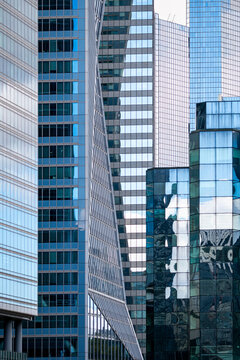Cluster of highrise towers overlapping in business core architecture facade office corporate urban abstract glass pattern modern district skyline