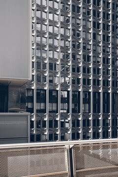 Repetitive facade modules and metal grid pattern architecture facade office corporate urban abstract glass pattern modern district background