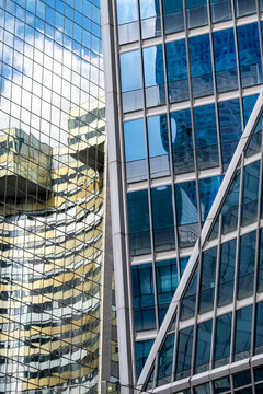 Mirrorlike office glass with distorted yellow reflection architecture facade office corporate urban abstract glass pattern modern district texture