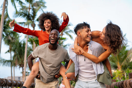 Happy travelers exploring a tropical destination with palm trees on a summer getaway