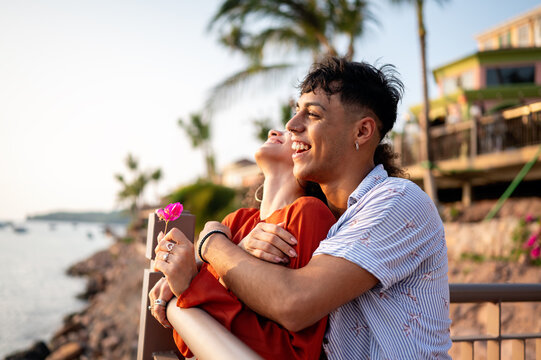 Married couple celebrates their love and bond through a quiet, intimate moment on the beach