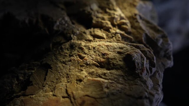 Warm light highlighting rock plateau surface with cinematic texture depth