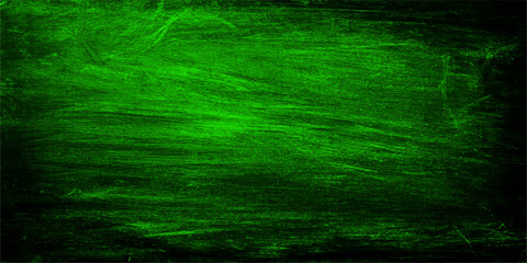 Fototapeta premium Abstract green texture with rough and grungy paint brushstrokes, creating a unique and artistic background.