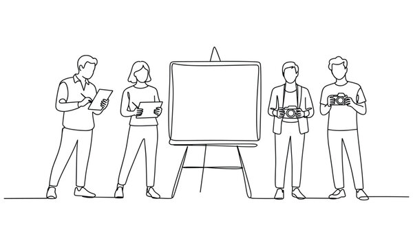 Team standing around whiteboard holding cameras and tablets.