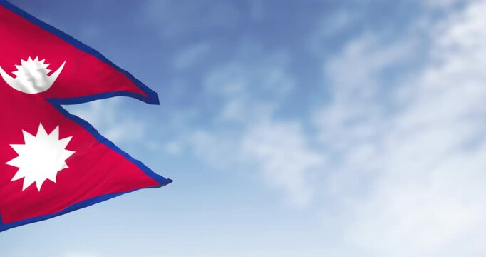Nepal National flag waving in the wind on a clear day. The only Non-quadrilateral national flag in the world. Seamless 3d render animation. Slow motion loop. Selective focus