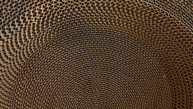 Top view of rolled brown corrugated cardboard sheet showing unique wavy spiral pattern. An ideal industrial background for concepts related to packaging recycling and sustainable logistics