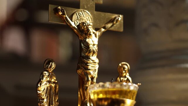 Clergy members assemble spiritual relics under soft candlelight