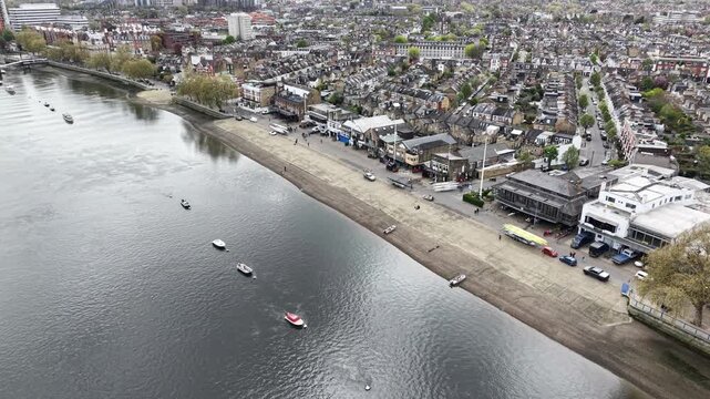 Panning drone aerial rowing clubs in Putney West London on River Thames