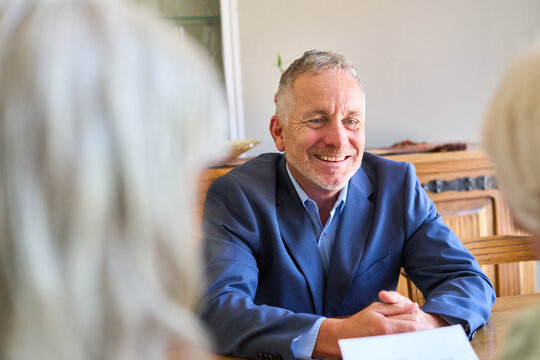 Retirement Planning And Financial Protection: Senior Couple Consulting With A Trustworthy Advisor For Long-Term Security