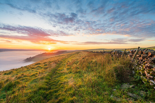 Beautiful sunrise scenery of Peak District with cloud inversion near Castleton. England