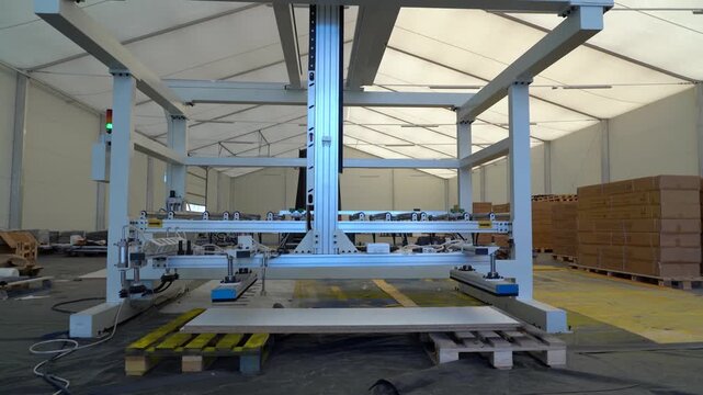 Industrial Vacuum Lifting Machine in Manufacturing Warehouse