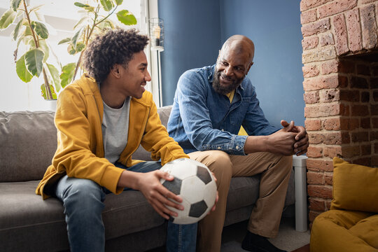 Father and son bonding over football toghether