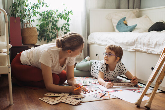 Mother and child learning together at home