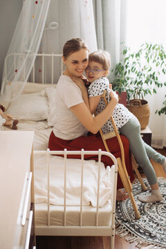 Mother embracing child with disability finding joy at home