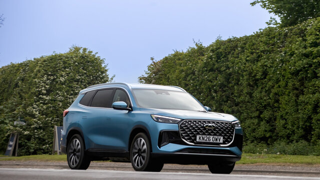 Bicester,Oxon.,UK - Apr 26th 2026: 2026 blue Chery Tiggo 8 Summit hybrid electric SUV car driving on a British road