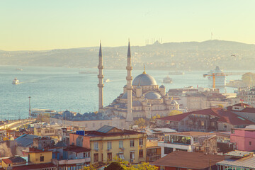 Naklejka premium Sunrise in Istanbul. The New Valide Sultan Mosque and the Çamlıca Mosque in the background.