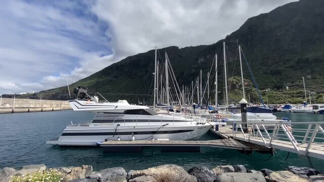 View of seaport and yacht marina by Garachico town on the northern coast of Tenerife, Canary Islands,Spain, 4K.	