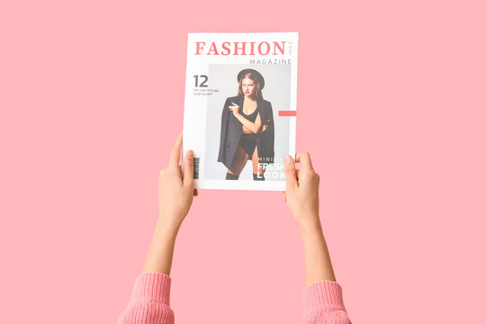 Young woman with fashion magazine on pink background