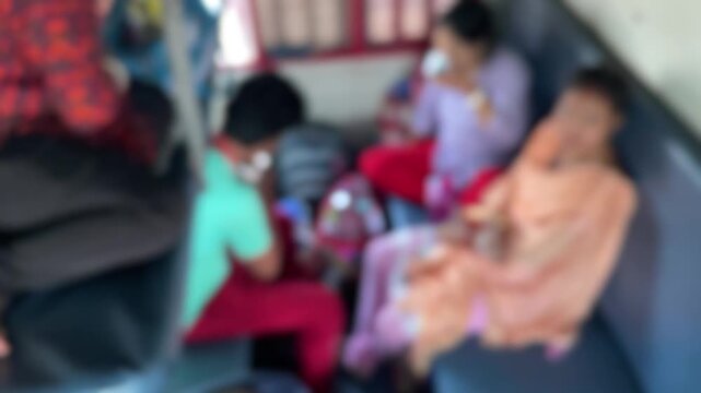 Blurred Interior of Indian Train with Passengers Showing Public Transport and Daily Commute