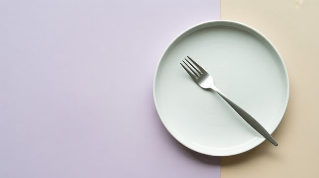 Empty Plate with Fork Placed Diagonally on Pastel Background with Large Copy Space for Minimal Food Concept Design


