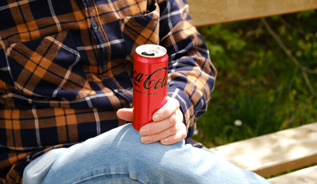 Person holding Coca-Cola Zero Sugar aluminium can. For beverage advertising, lifestyle branding, and casual outdoor campaigns. Prague - April 28, 2026.