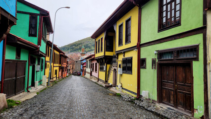 Fototapeta premium Afyonkarahisar old town showcases traditional Ottoman houses with whitewashed walls, timber frames, and narrow streets.