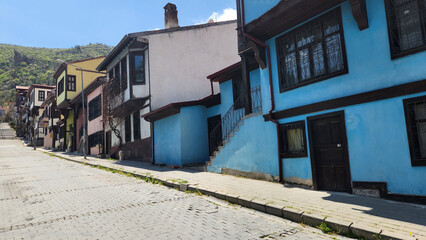Fototapeta premium Afyonkarahisar old town showcases traditional Ottoman houses with whitewashed walls, timber frames, and narrow streets.