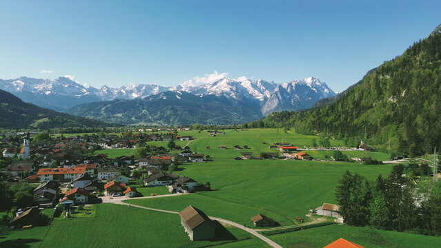 Village landscape with dramatic mountains
