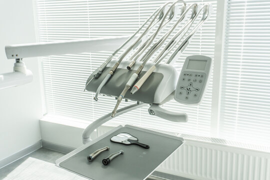 modern new dental chair, installation and tools in the clinic, bur machine, oral health and hygiene, dental office, surgery