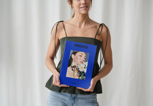 Mockup Of Woman Holding Customizable Booklet