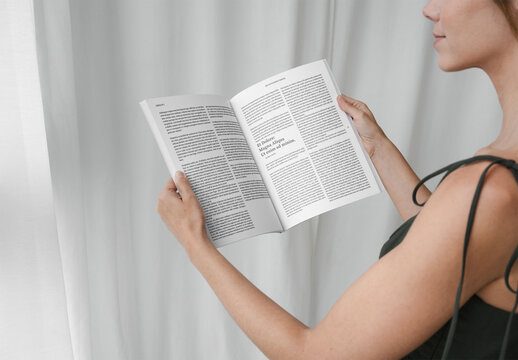 Mockup Of Woman Reading Open Customizable Magazine