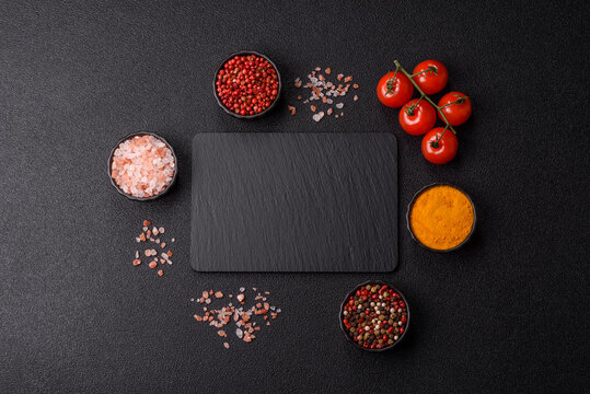 A blank slate board on a dark background for Asian food. A blank slate board