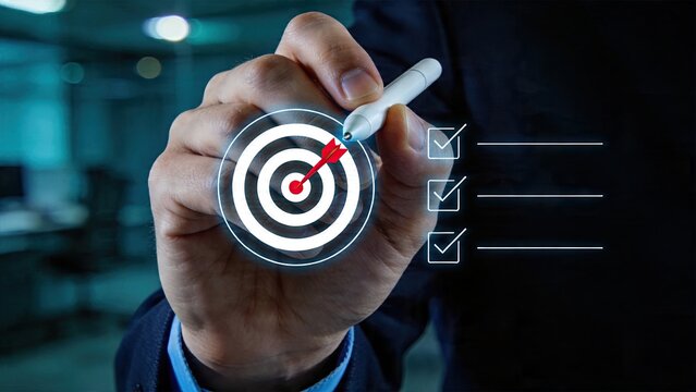 Businessman hand using digital touchscreen pen to select target hitting bullseye goal checking off task list on screen success management strategy concept