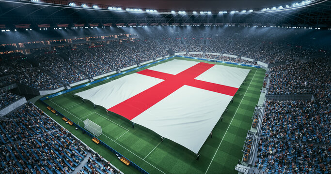 Professional Stadium Soccer Game Championship With Flag of England Spread Across the Pitch Before Football Match Start. Cheering Crowds of Fans Surround the Field. Aerial Wide Shot