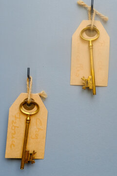 Brass Keys Hanging on a Blue Wall