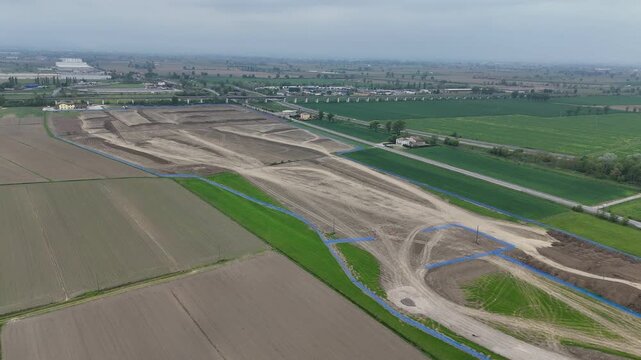 Logistics park construction site near Fiorenzuola d&rsquo;Arda Piacenza Emilia Romagna Italy with large earthworks and road layout adjacent to Autostrada A1 and A21 dir connection within Po Valley
