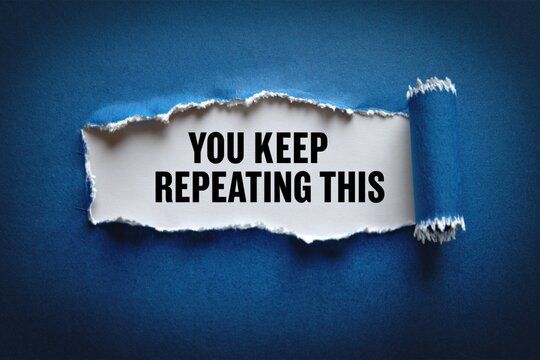 You Keep Repeating This Message on Torn Blue Paper