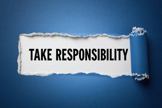 Take Responsibility Motivational Concept on Blue Paper